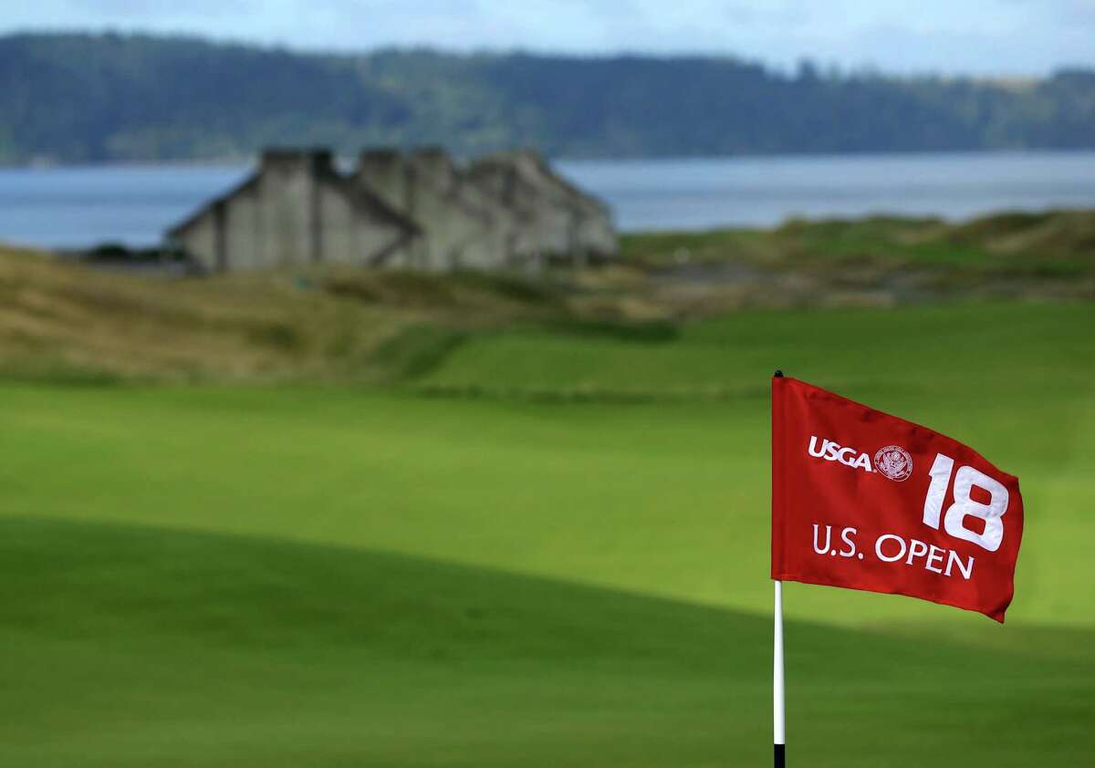 The U.S. Open 18th hole flag is shown at Chambers Bay, the host course for the 2015 U.S. Open golf tournamen, in University Place, Wash.
