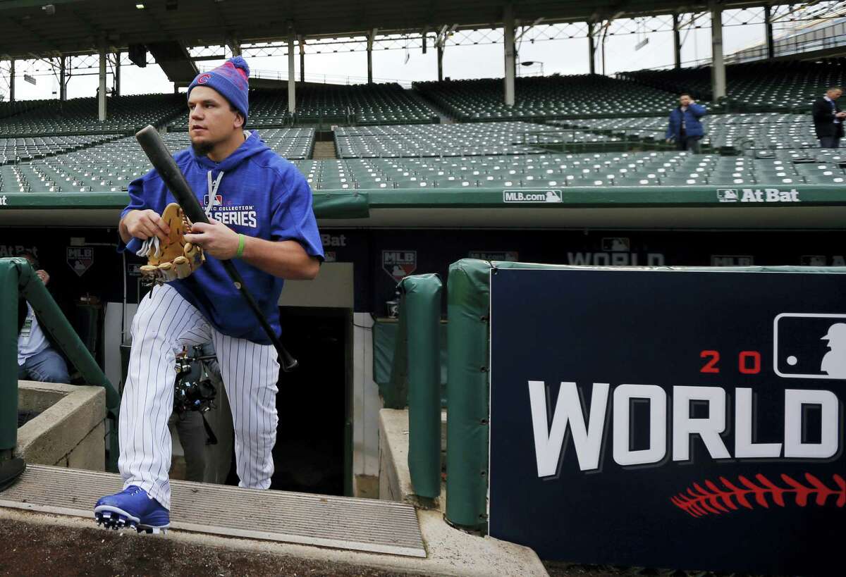Kyle Schwarber walks out to the field to work out Thursday at Wrigley Field in Chicago.
