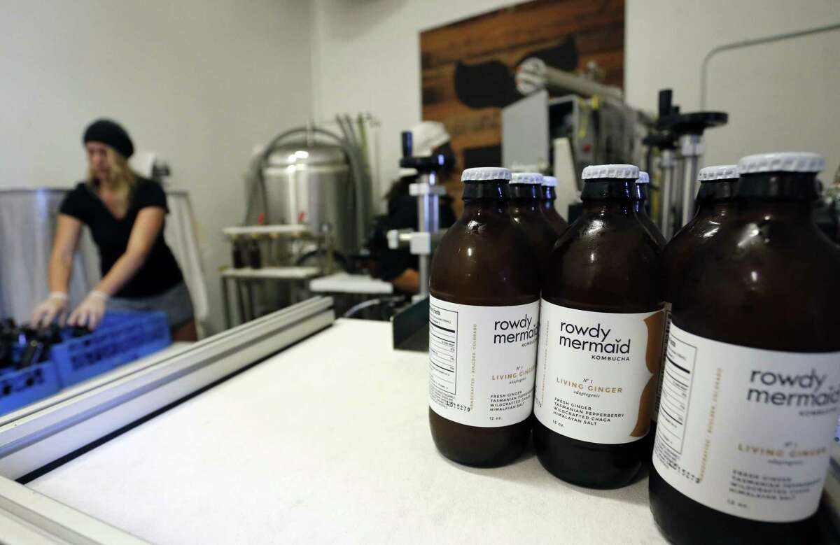 Employee Hannah Melby works Oct. 6 on a bottling run of Living Ginger, one of several kombucha varieties produced at Rowdy Mermaid, a kombucha manufacturer in Boulder, Colo. The tangy, probiotic fermented tea called kombucha has moved from America’s natural foods aisle to the mainstream.