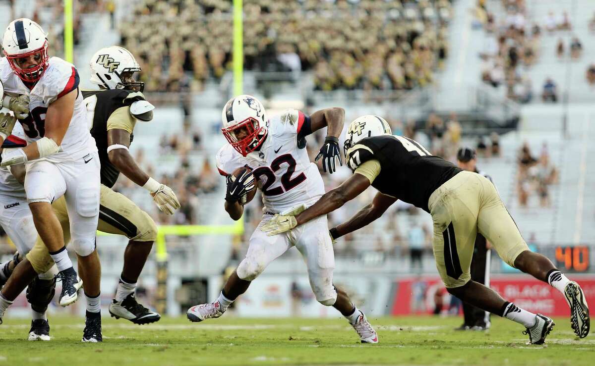 UConn’s Arkeel Newsome (22) finished with 257 all-purpose yards in Saturday’s win over UCF.