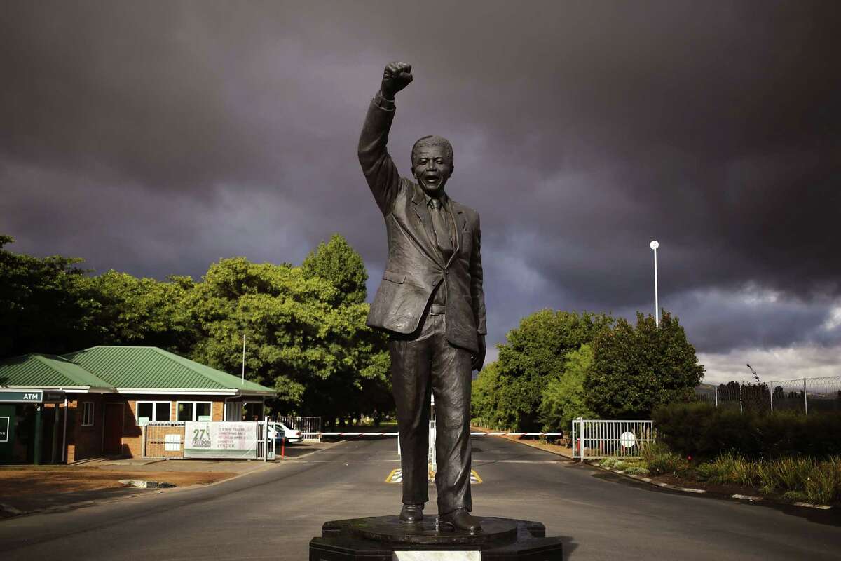 A statue of former South African President Nelson Mandela, with a raised fist, stands outside the former Victor Verster prison, renamed to Drakenstein Correctional center, near the town of Franschhoek, South Africa, Tuesday, Feb. 10, 2015. On Feb. 11, 1990, former South African President Nelson Mandela walked free from the Victor Verster prison with his then wife Winnie Madikizela-Mandela, with a raised fist in the air after being jailed for 27 years by the former South African Apartheid Government. Tomorrow marks the 25th anniversary of Mandela's release from prison. (AP Photo/Schalk van Zuydam)