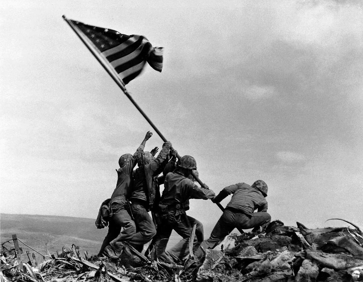 In this Feb 23, 1945 file photo, U.S. Marines of the 28th Regiment, 5th Division, raise the American flag atop Mt. Suribachi, Iwo Jima, Japan. The Marines Corps announced Thursday that one of the six men long identified in the iconic World War II photograph was actually not in the image. A panel found that Private First Class Harold Schultz, of Detroit, was in the photo and that Navy Pharmacist’s Mate 2nd Class John Bradley wasn’t in the image. Bradley had participated in an earlier flag-raising on Mount Suribachi.