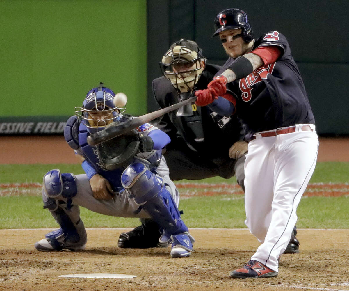 Cleveland’s Roberto Perez hits a three-run home run against the Chicago Cubs during the eighth inning of Game 1 of the World Series Tuesday. The Indians took the opener 6-0.