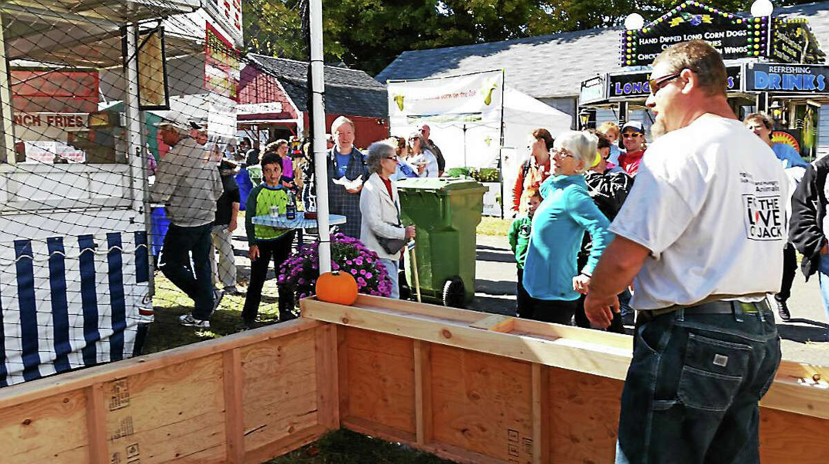 An unidentified patron tries her hand at one of the games during the 106th annual Riverton Fair Saturday, Oct. 10, 2015.