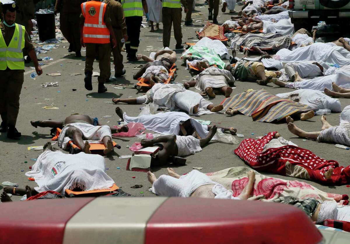 In this Thursday, Sept. 24, 2015 file photo, bodies of people who died in a crush in Mina, Saudi Arabia during the annual hajj pilgrimage lie in a street. Hundreds were killed and injured, Saudi authorities said. The crush happened in Mina, a large valley about five kilometers (three miles) from the holy city of Mecca that has been the site of hajj stampedes in years past. A new tally shows last month’s crush and stampede at the Saudi hajj was the deadliest event to ever strike the annual pilgrimage. The Associated Press count Friday, Oct. 9, 2015, shows at least 1,453 people died Sept. 24 in Mina. Saudi officials have said their official figure of 769 killed and 934 injured in the disaster remains accurate.