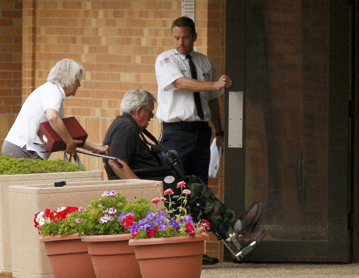 Former Speaker of the House Dennis Hastert, middle, reports to the Federal Medical Center in Rochester, Minn., on Wednesday, June 22, 2016, in a to serve a 15-month sentence.