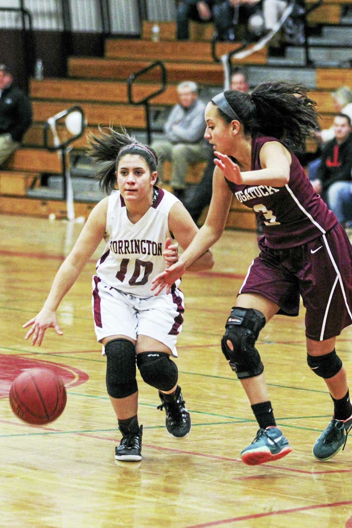 Alexis Tyrrell, guarded here by Naugatuck’s Alyana Sosa, had a game-high 14 points for Torrington Tuesday night.