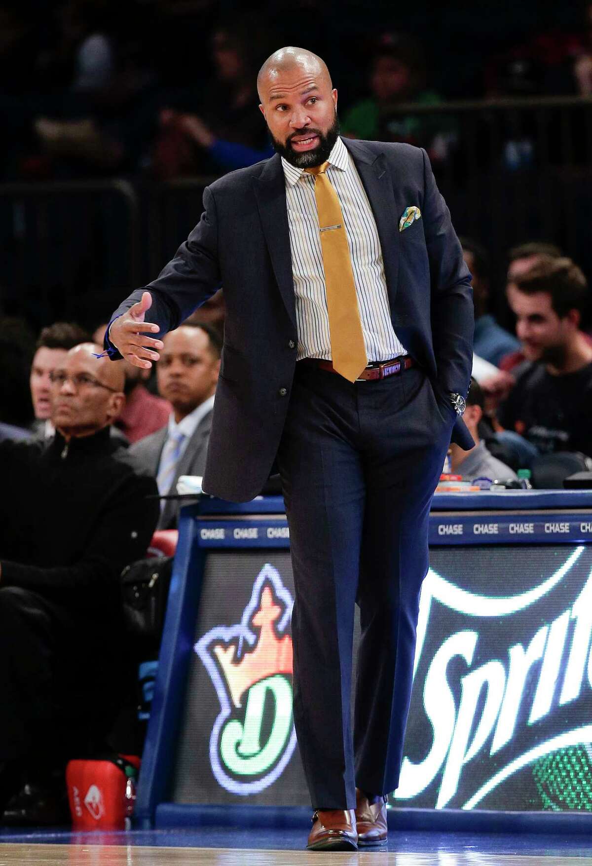 Knicks head coach Derek Fisher motions to a referee during the second quarter of a preseason game against Paschoalotto Bauru on Wednesday in New York.