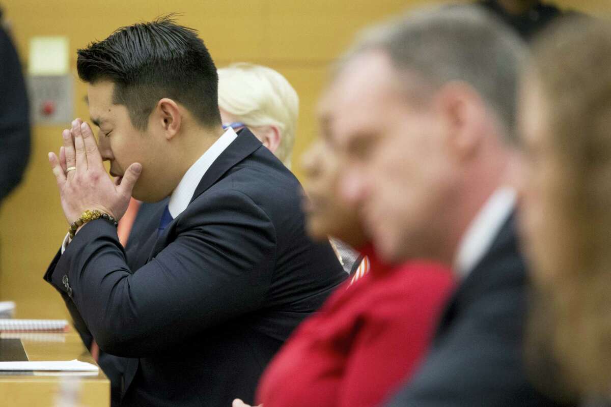 Police officer Peter Liang reacts as the verdict is read during his trial on charges in the shooting death of Akai Gurley, Thursday, Feb. 11, 2016 at Brooklyn Supreme court in New York in New York.
