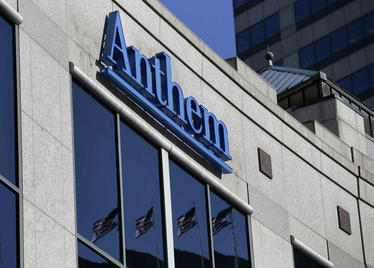 In this Feb. 5, 2015 photo, the Anthem logo hangs at the health insurer’s corporate headquarters in Indianapolis.