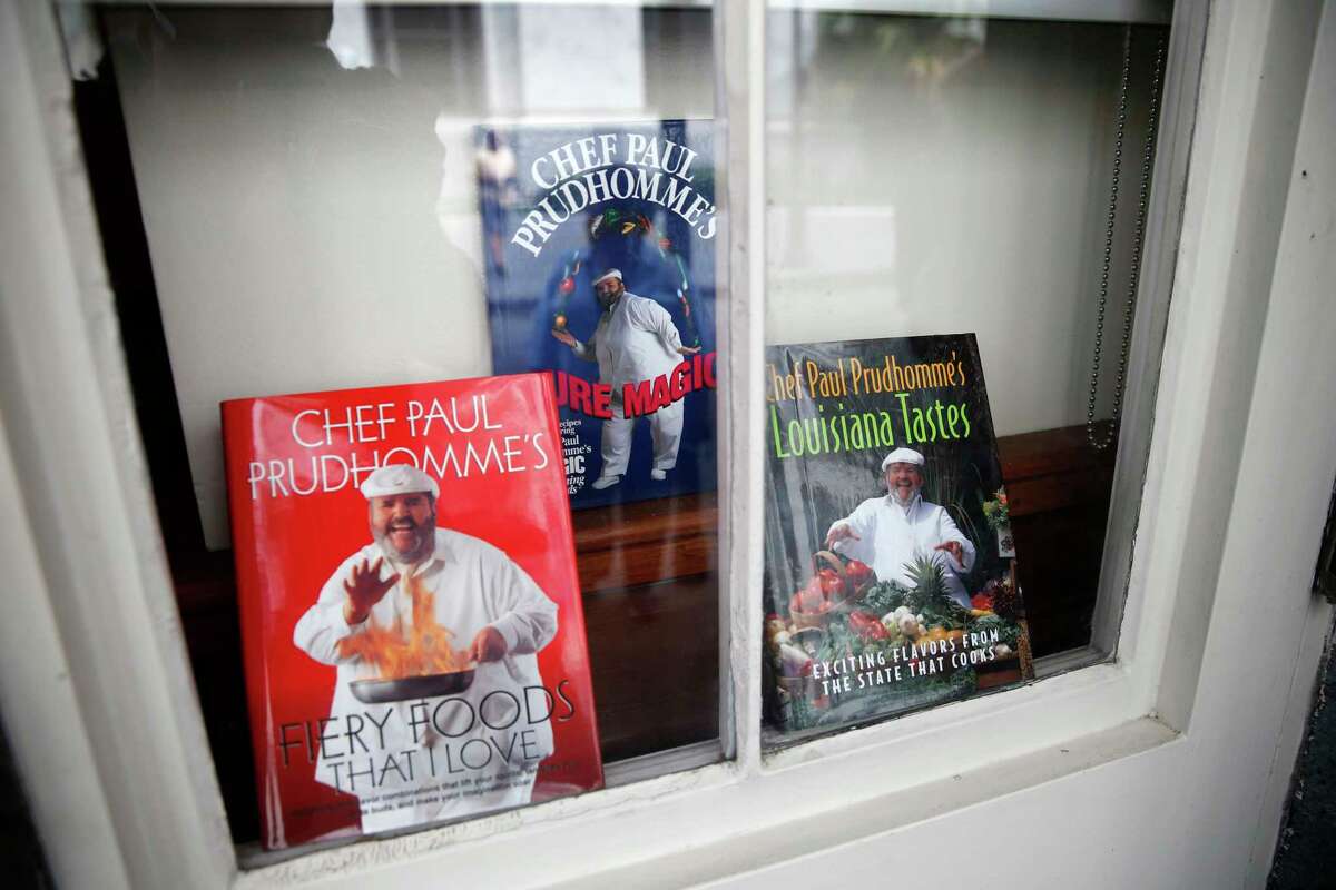 Cookbooks by Chef Paul Prudhomme are displayed in a window at K-Paul’s Louisiana Kitchen in the French Quarter of New Orleans, Thursday, Oct. 8, 2015. The proprietor, famed New Orleans Chef Paul Prudhomme, passed away Thursday. He was 75.