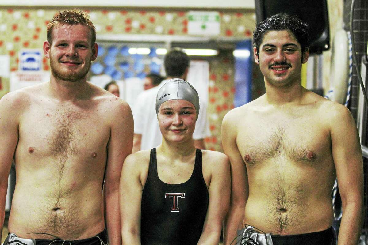 Photo by Marianne KillackeyWolcott Tech's Kurtis Wilson (left), Annalise Erwin and Ezra Olsen aren't allowed to score as attached members of the Torrington swimming and diving team, but they're full participants in the fun, excitement and intensity of a night like Wednesday's.