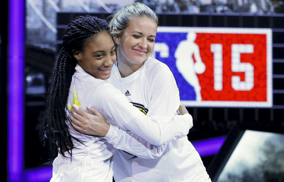 Kristen Ledlow, right, hugs Mo’ne Davis as they are announced before the NBA All-Star celebrity basketball game in New York in 2015.