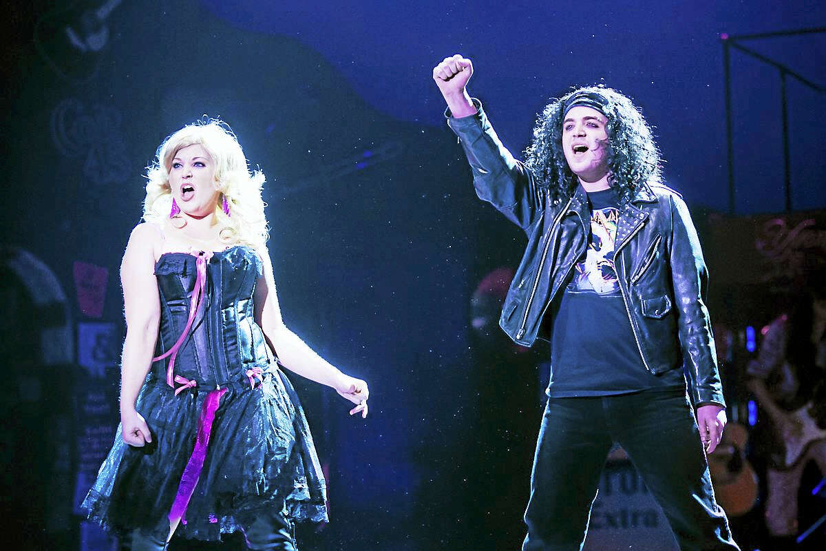 Photos by Mandi MartiniWarner Stage Company actors Noel Roberge as Drew Boley and Katie Brunetto as Sherrie Christian in a scene from Rock of Ages, which closes Sunday at the Warner Theatre.