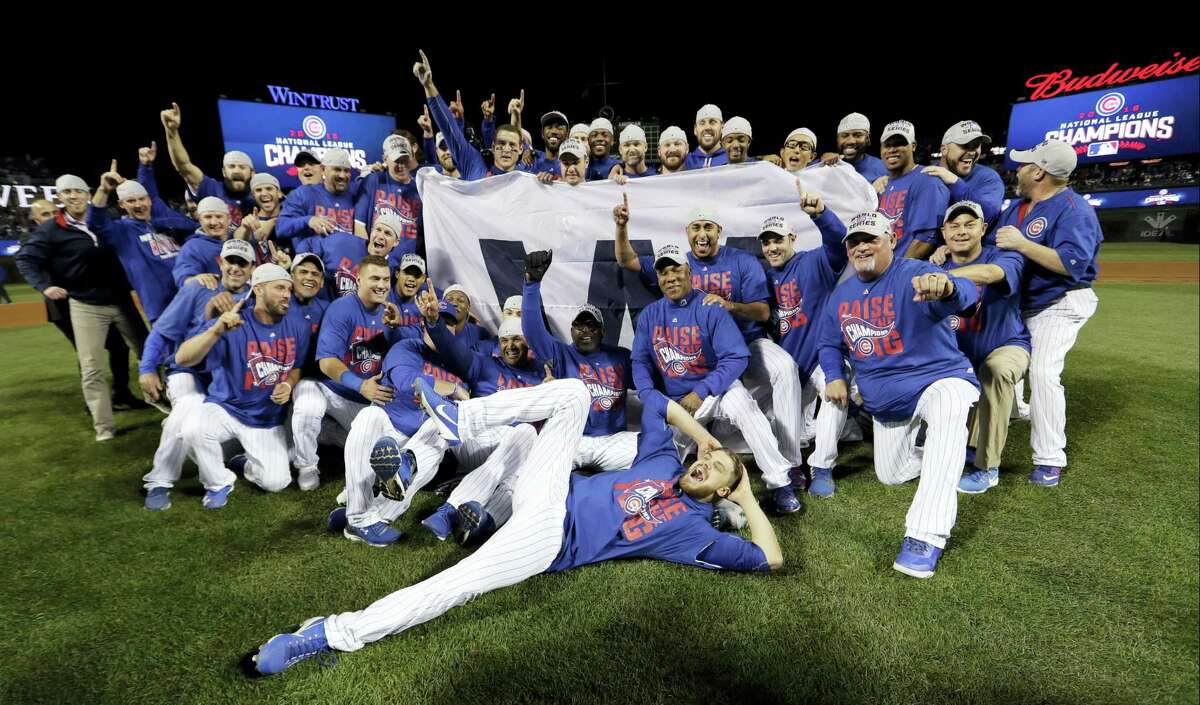Chicago Cubs players celebrate after Game 6 of the National League baseball championship series against the Los Angeles Dodgers on Oct. 22, 2016 in Chicago. The Cubs won 5-0 to win the series and advance to the World Series against the Cleveland Indians.