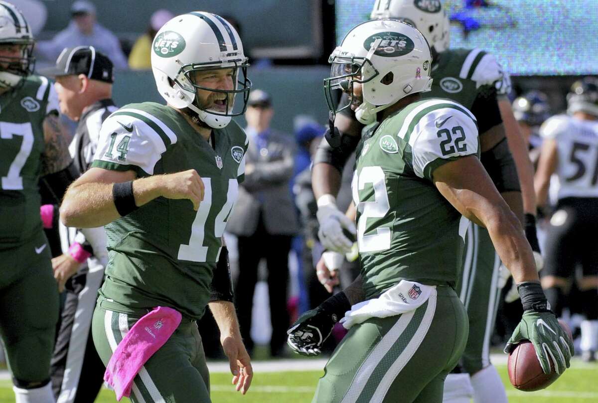 Jets quarterback Ryan Fitzpatrick, left, celebrates with running back Matt Forte after Forte scored a touchdown in the second quarter Sunday.