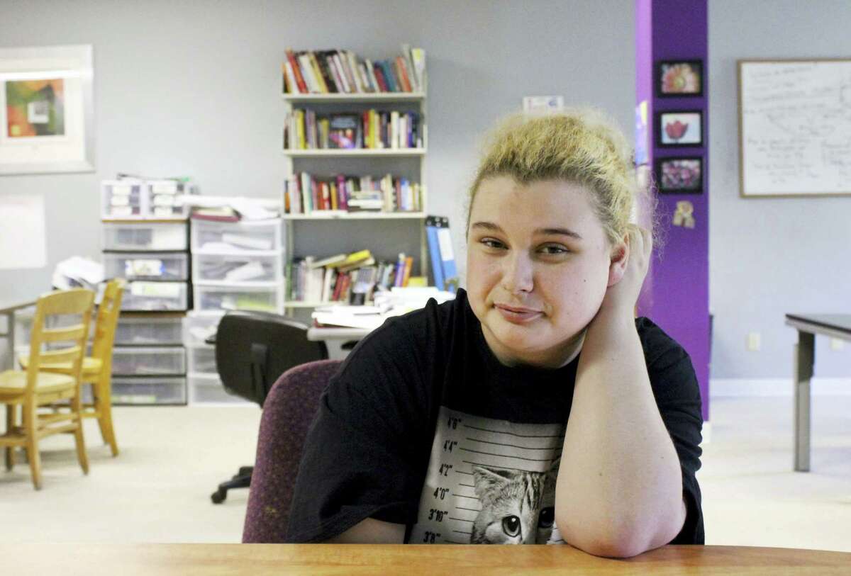 In this May 19, 2016 photo, Paige Petri, a student, poses at Horizon High School, a school that allows teens to get counseling and drug testing while they study alongside other recovering addicts, in Madison, Wis. Petri said she started smoking pot and getting high on cough medicine two years ago. Now a student at Horizon, she said she expects to graduate in a couple of years and that it likely wouldn’Äôt have been possible if not for the Madison school.
