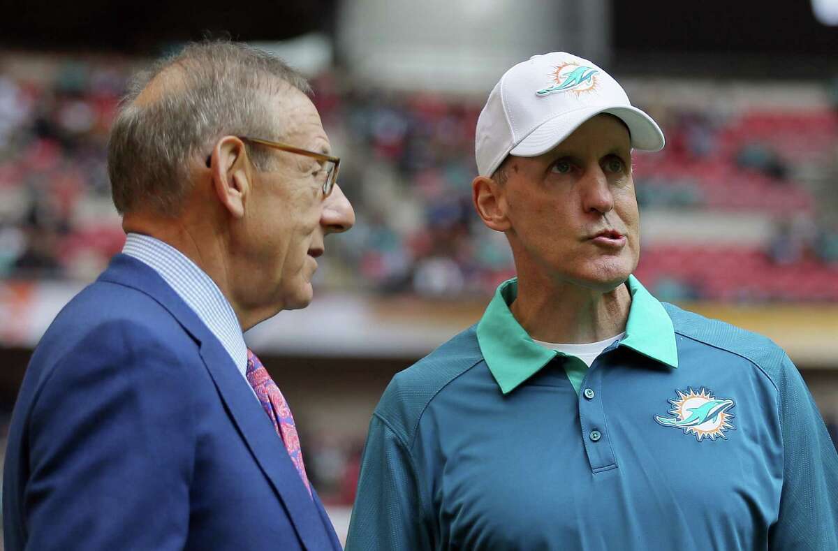 In this file photo from October, Miami Dolphins owner Stephen Ross, left, and Miami Dolphins head coach Joe Philbin chat during warm-ups. Philbin was fired Monday.