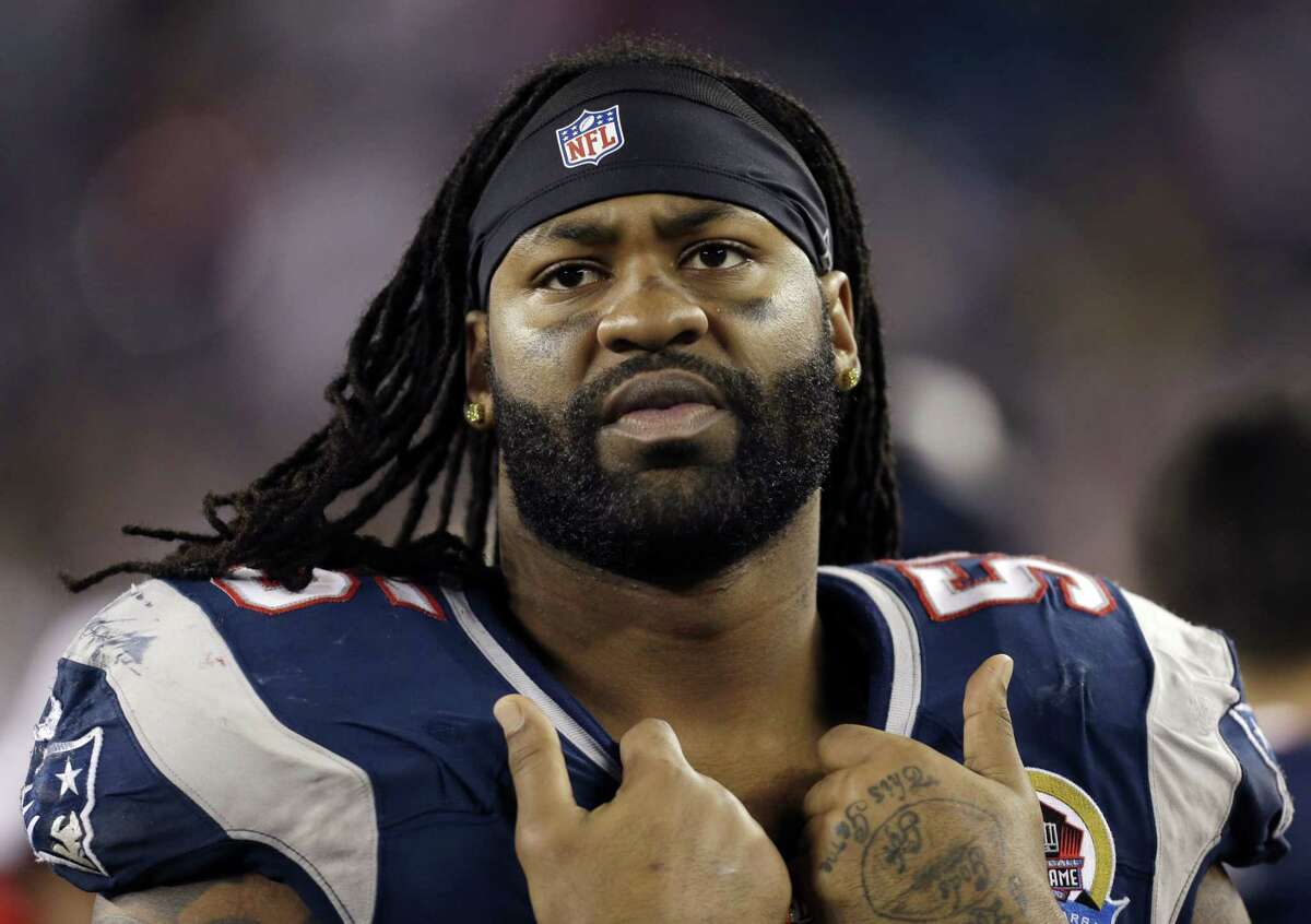 In this Dec. 10, 2012 photo, New England Patriots’ Brandon Spikes watches from the bench in the fourth quarter of an NFL football game against the Houston Texans in Foxborough, Mass.