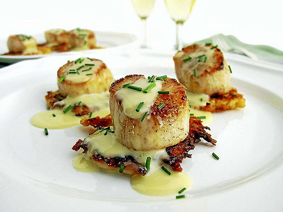 A delicious sauce and a special side can elevate a plate of scallops to new heights.