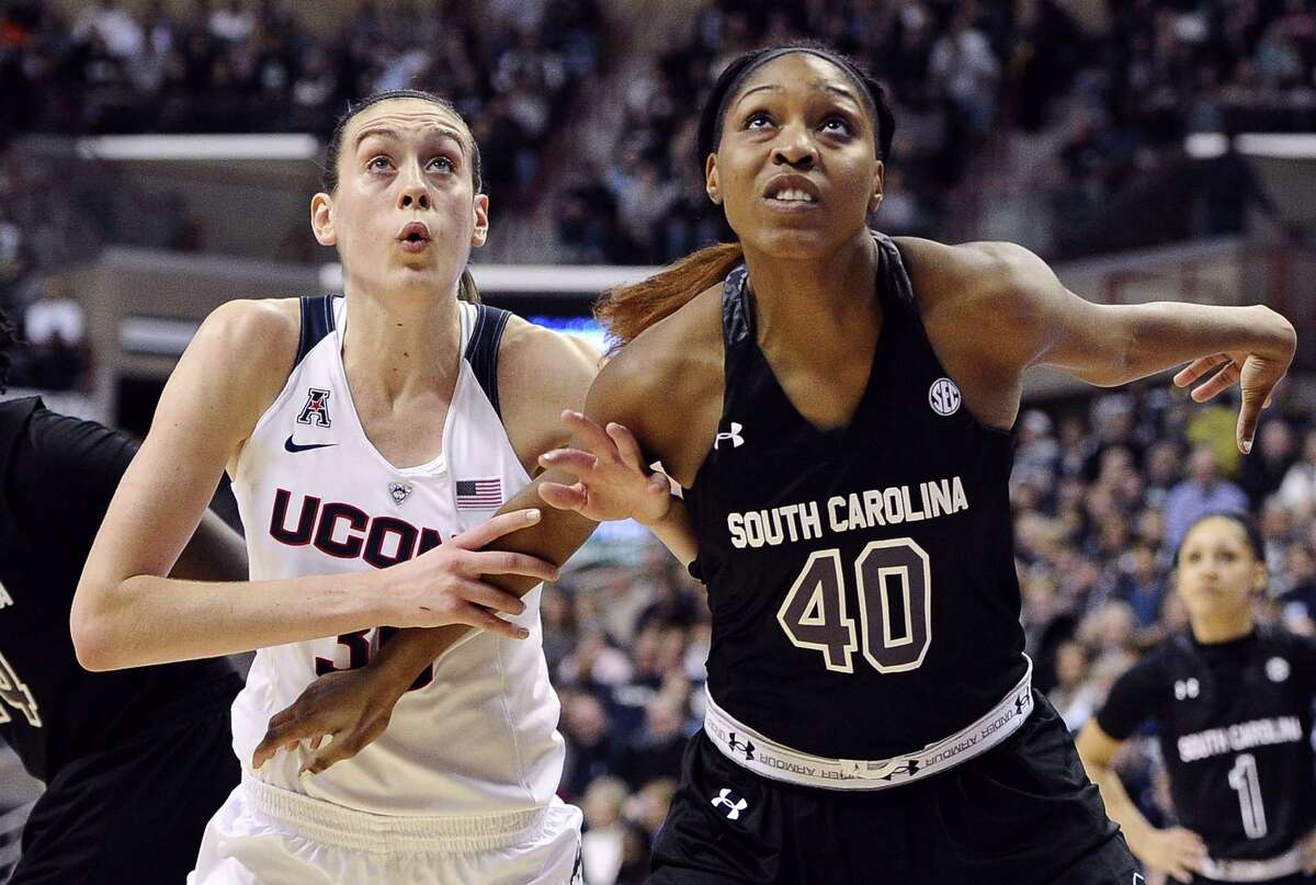 Connecticutís Breanna Stewart, left, and South Carolinaís Jatarie White, right, look for a rebound during the first half of an NCAA college basketball game, Monday, Feb. 9, 2015, in Storrs, Conn. (AP Photo/Jessica Hill)