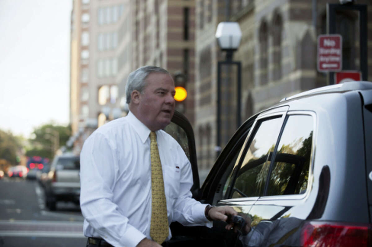Former Gov. John G. Rowland leaving U.S. District Court in 2014.