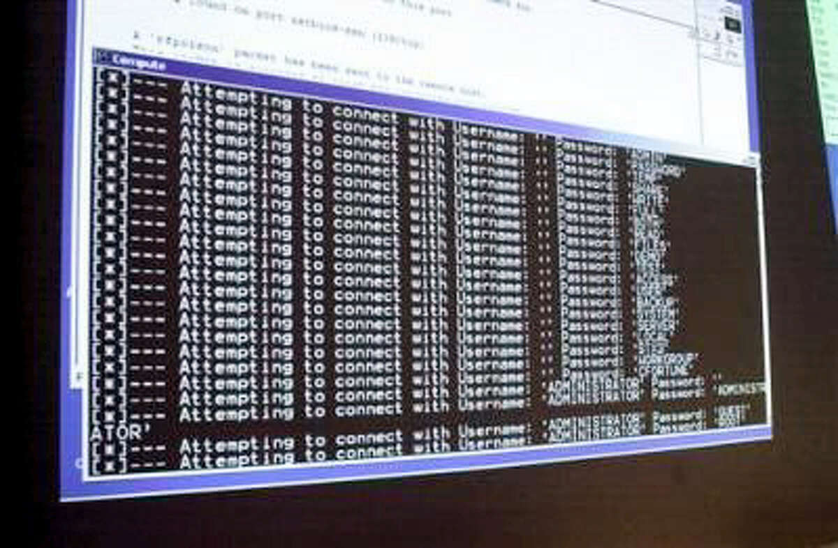 In this Thursday, Jan. 10, 2002, file photo, a computer screen shows a password attack in progress at the Norwich University computer security training program in Northfield, Vt.