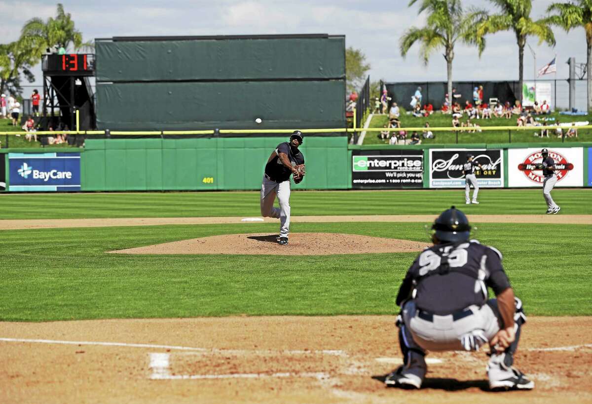 New York Yankees minor leaguer pitcher Luis Severino throws to catcher Austin Romine during a spring training game on March 3 in Clearwater, Fla.
