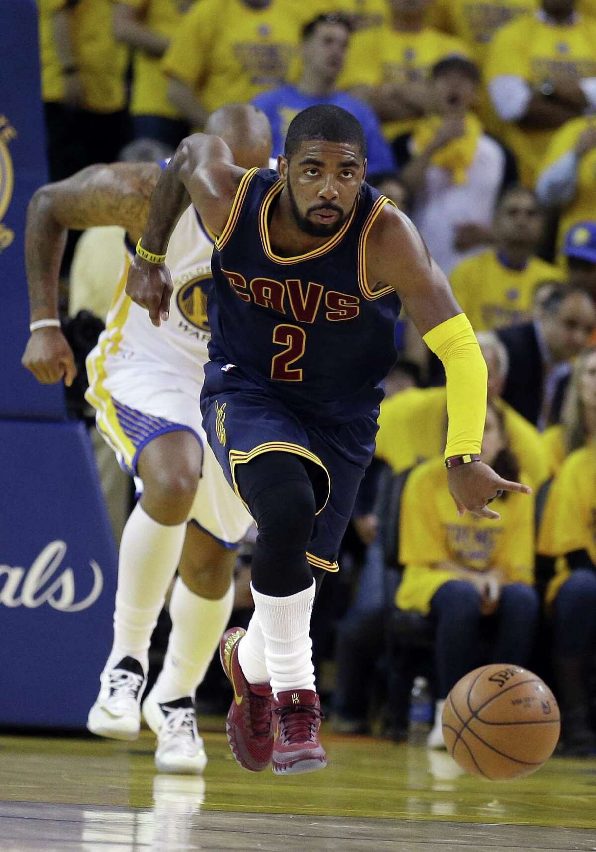 Cleveland Cavaliers guard Kyrie Irving dribbles up the floor against the Golden State Warriors during Game 1 of the NBA Finals on Thursday night in Oakland, Calif.