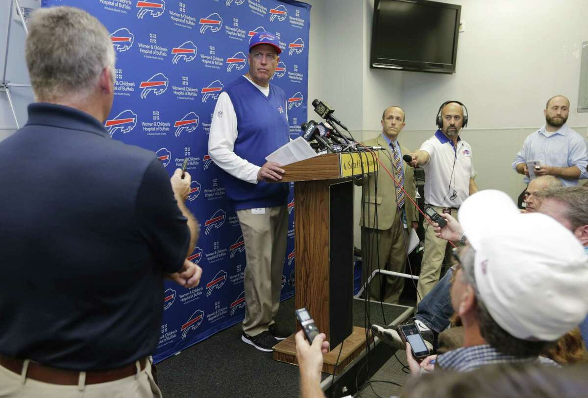 Bills head coach Rex Ryan, center, speaks to members of the media.