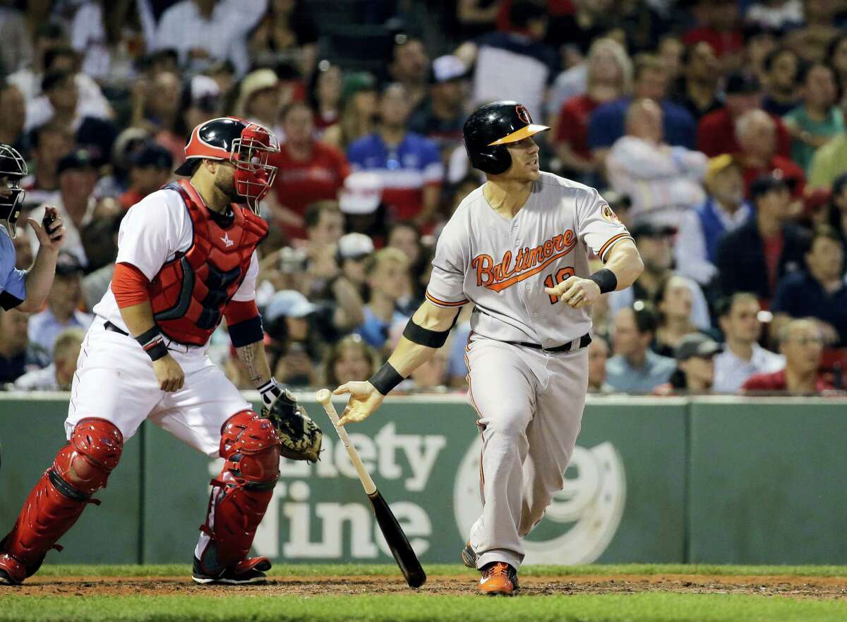 Baltimore’s Chris Davis hits an RBI single in the fifth inning of the Orioles’ 5-1 win over the Red Sox at Fenway Park.