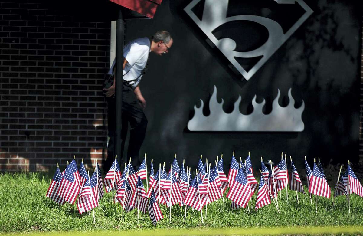 American flags, one for each victim of Sunday’s mass shooting, stand outside a firehouse next to the Pulse nightclub on June 16, 2016 in Orlando, Fla.