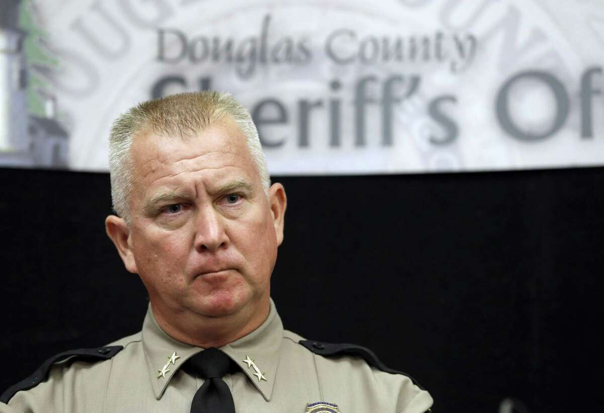 Douglas County Sheriff John Hanlin listens to a reporters question during a news conference Friday, in Roseburg, Ore., concerning the deadly shooting at Umpqua Community College.