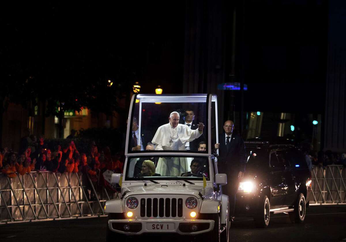 Pope Francis waves to the crowd from the popemobile during a parade in Philadelphia on Sept. 27.