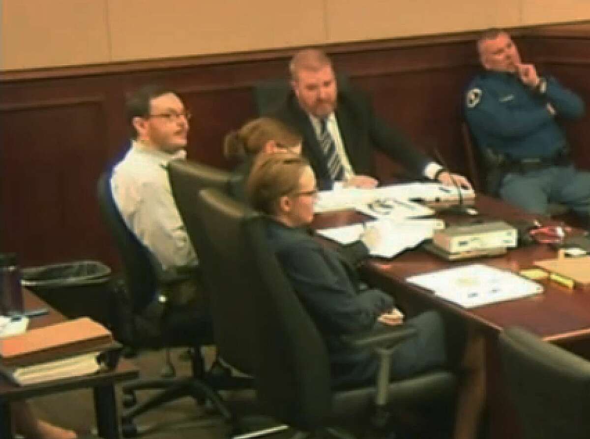 File - In this April 27, 2015 file photo taken from video, Colorado movie theater shooter James Holmes, far left, sits with his defense team during his trial at the Arapahoe County Justice Center, in Centennial, Colo. Homes trial Judge Carlos Samour rejected defense attorneys' second request for a mistrial Wednesday, June 3, 2015, over video shown in court of a psychiatrist's interview with Holmes. (Colorado Judicial Department via AP, Pool, file)
