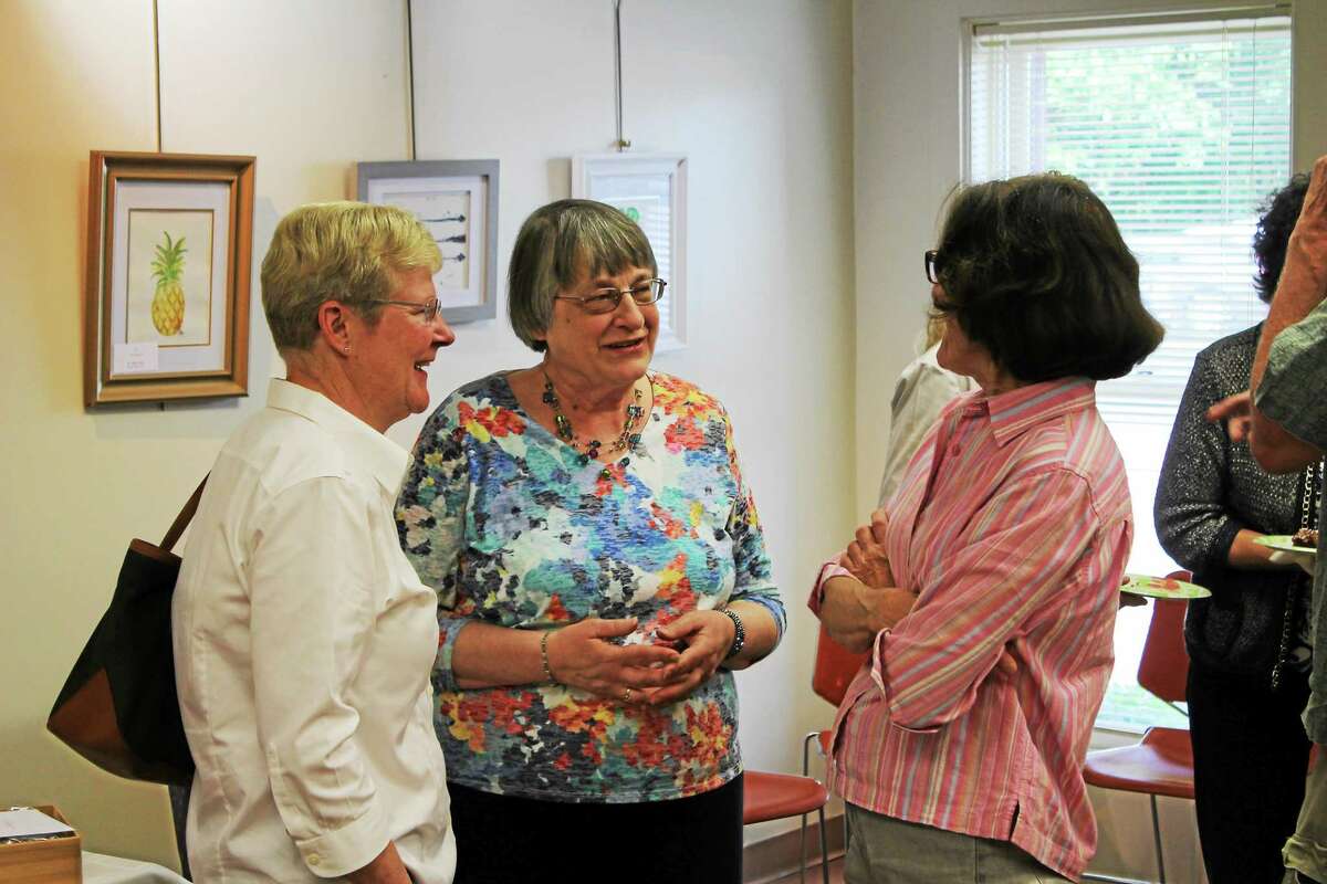 Harwinton Public Library Director Stasia Motuzick, who is retiring, speaks to well-wishers at Wednesday’s event.