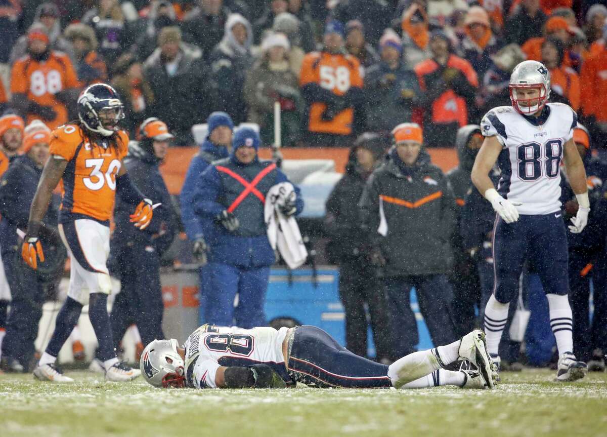Patriots tight end Rob Gronkowski lies injured on the field against the Broncos during the fourth quarter Sunday in Denver.