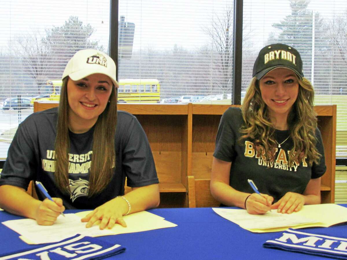 Photo by Peter Wallace Lewis Mills soccer stars Maddie Murdick (left) and Ailene Berry became just the second and third Division I signees in the Spartans' illustrious girls soccer history Wednesday afternoon at Lewis Mills High School. Murdick, a two-year All-State and All-Berkshire League player, heads for the University of New Hampshire in the fall. Berry, going to Bryant College, was injured last year but scored 21 goals with 18 assists as a junior in an undefeated regular season for Mills.