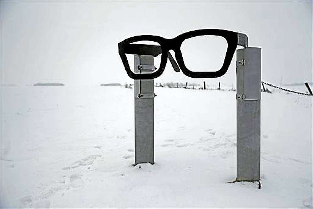 A monument depicting musician Buddy Holly’s glasses stands at the edge of a snowy field near the spot where the plane carrying Holly, Ritchie Valens and J.P. “The Big Bopper” Richardson crashed near Clear Lake, Iowa. The three performers died in the crash Feb 3, 1959, after their final performance in Clear Lake.