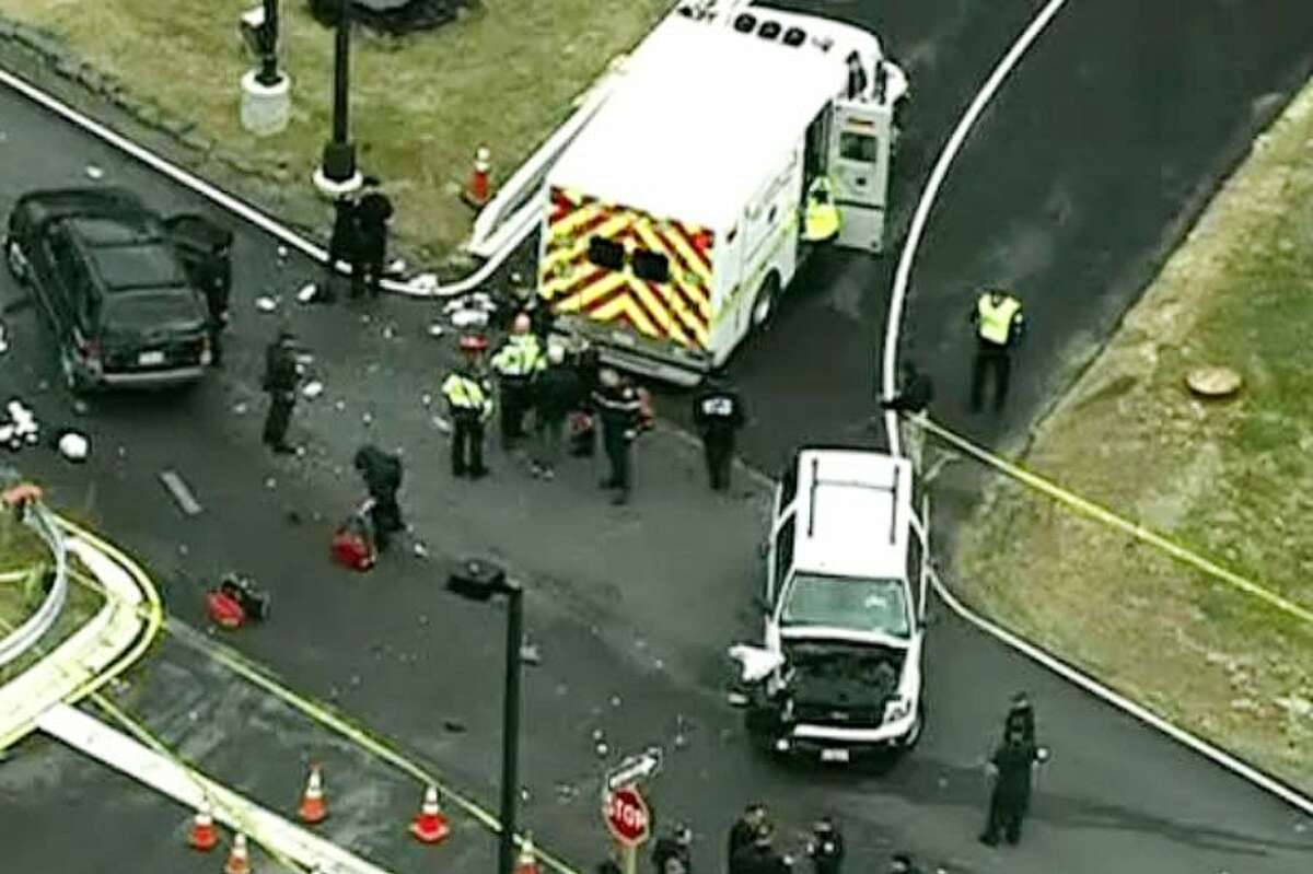 In this image made from video and released by WJLA-TV, authorities investigate the scene of an accident near a gate to Fort Meade, Md. on Monday.