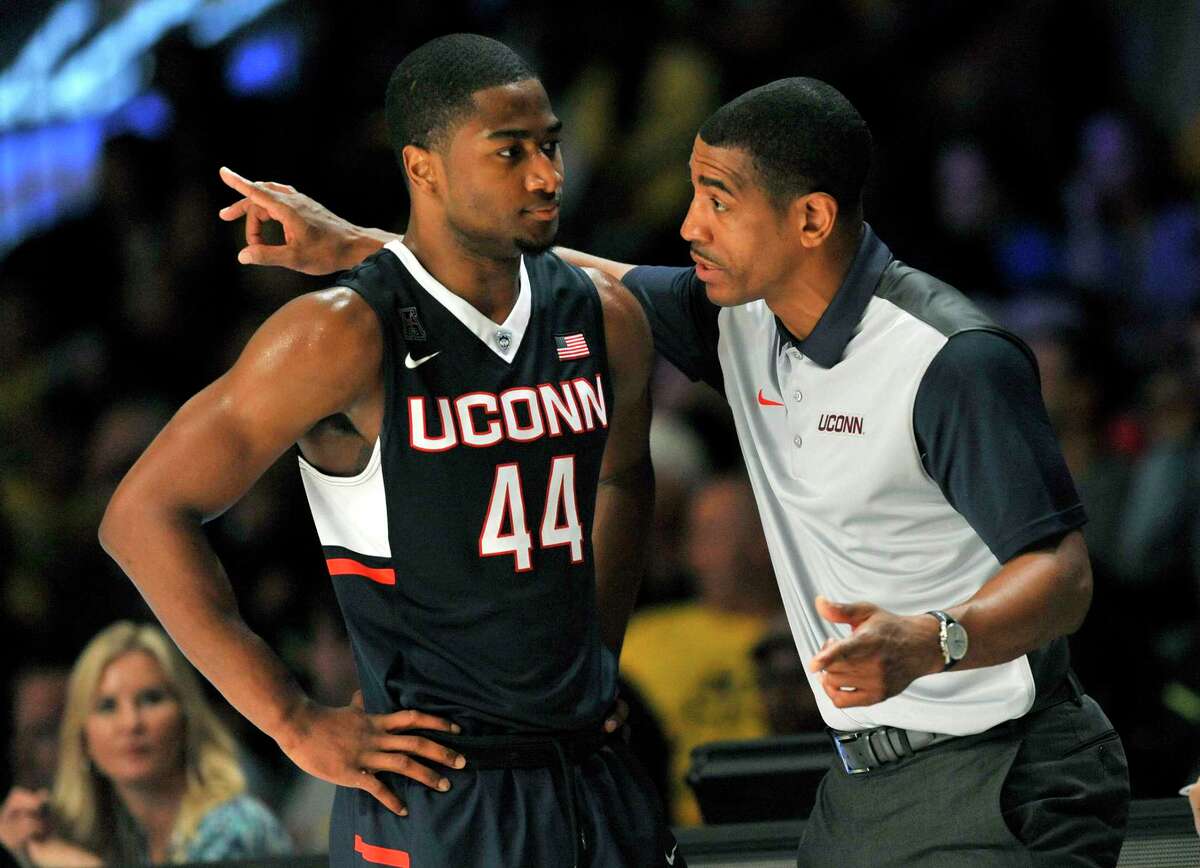 UConn coach Kevin Ollie has a word with guard Rodney Purvis (44) during a game against Michigan on Wednesday in Paradise Island, Bahamas.