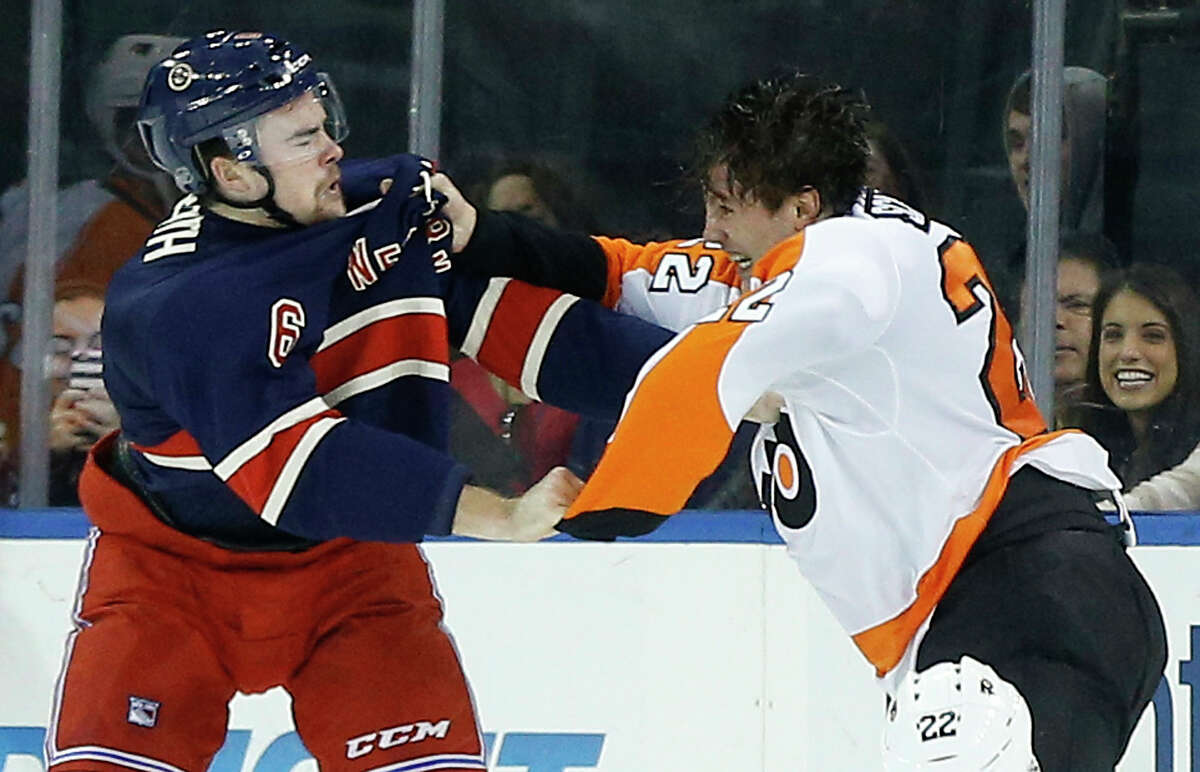 Rangers defenseman Dylan McIlrath (6) fights with Philadelphia Flyers defenseman Luke Schenn (22) during the first period Saturday.