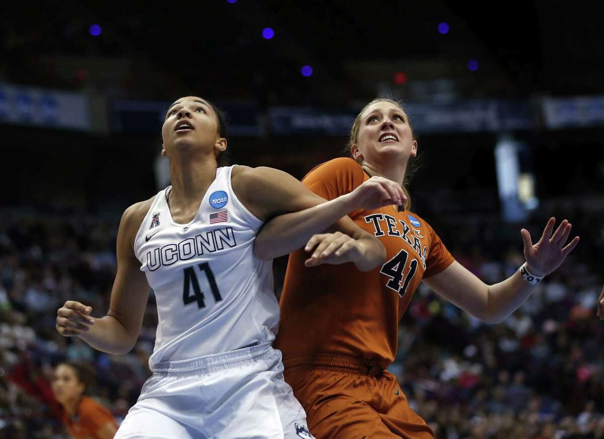Connecticut center Kiah Stokes (41) and Texas' Lilley Vander Zee battle for position during the second half of a women's college basketball regional semifinal game in the NCAA Tournament on Saturday, March 28, 2015, in Albany, N.Y. (AP Photo/Mike Groll)