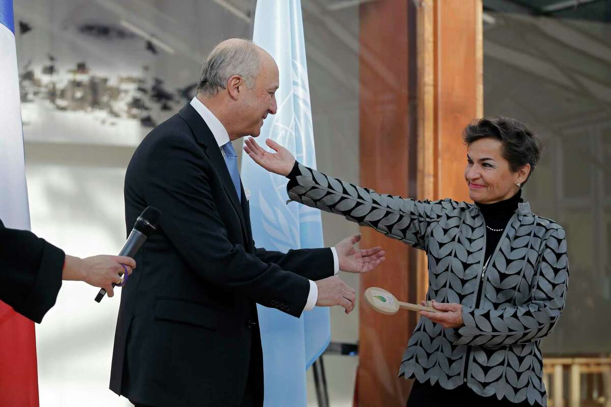 French Foreign Minister Laurent Fabius hands over the keys of Le Bourget to United Nations climate chief Christiana Figueres, right, at the venue of the U.N Climate Conference in Le Bourget, outside Paris, Saturday Nov. 28, 2015. The site of Paris-Le Bourget will officially become United Nations territory for the COP 21 conference where more than 100 heads of state are expected to attend and is scheduled to start on Nov. 30.