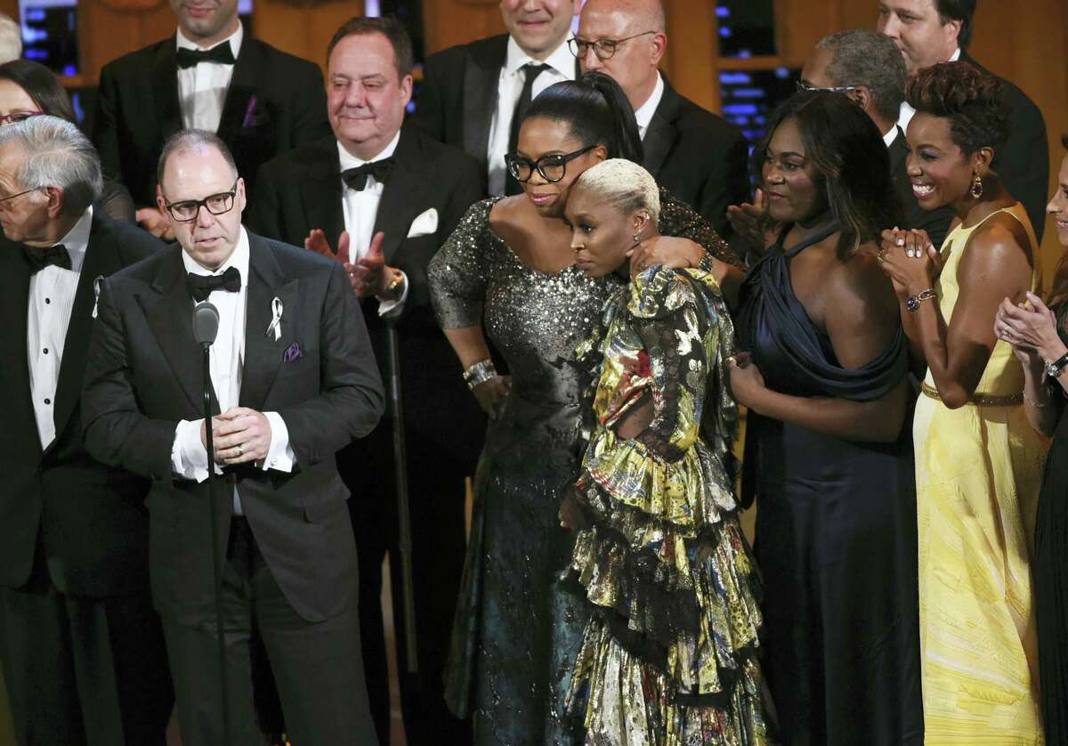 Producer Scott Sanders, left, accepts the Tony Award for Best Revival of a Musical for ‘The Color Purple’ with his cast and creative team including Oprah Winfrey, center, and Cynthia Erivo at the Tony Awards at the Beacon Theatre on June 12, 2016 in New York.