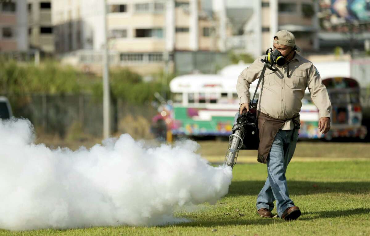 A health ministry worker fumigates for Aedes aegypti mosquitoes where carnival celebrations will be held in Panama City, Tuesday, Feb. 2, 2016. Authorities announced on Monday that 50 cases of the Zika virus infection have been detected in Panama’s sparsely populated Guna Yala indigenous area along the Caribbean coast. The Aedes aegypti mosquito is vector for the spread of the Zika virus.