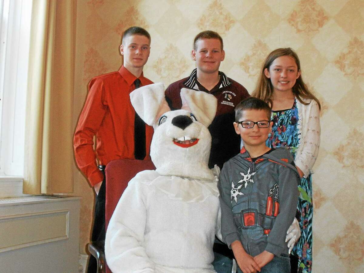 Tyler Rovero, 9, Owen Wilson, 15, Kirsten Rovero, 12, and Kurtis Wilson, 15, pose with the Easter Bunny at Torrington Elk’s Club’s Breakfast with the Easter Bunny on Sunday.