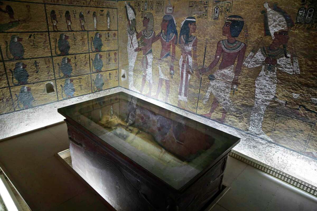 In this Tuesday, Sept. 29, 2015, file photo, the tomb of King Tut is displayed in a glass case at the Valley of the Kings in Luxor, Egypt, Tuesday. On Saturday, Nov. 28, 2015, Antiquities Minister Mamdouh el-Damaty said there is a 90 percent chance that hidden chambers will be found within King Tutankhamun’s tomb, based on the preliminary results of a new exploration of the 3,300-year-old mausoleum.
