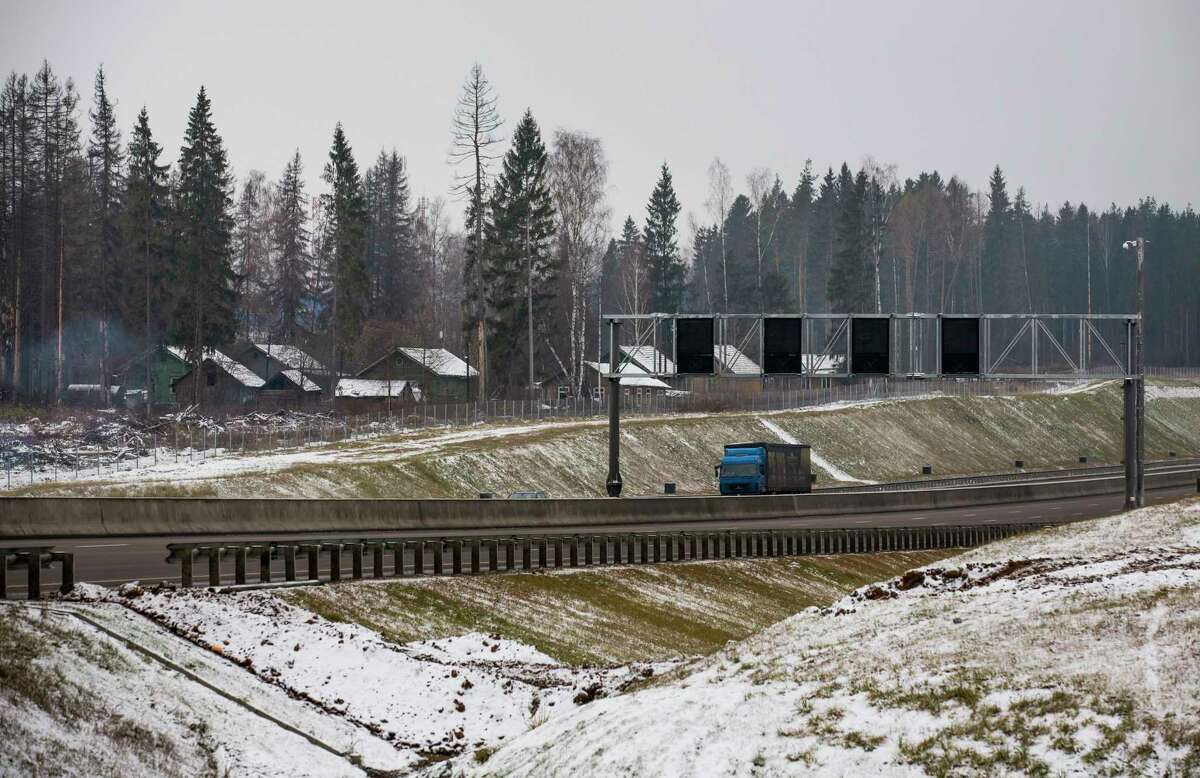 A truck drives along a new highway in Moscow region in this Tuesday, Nov. 17, 2015, photo. As the climate warms, moisture levels are changing with wet areas becoming wetter and dry areas drier. Russia is the fastest warming part of the world, according to a report from the country’s weather monitoring agency. The steady rise in temperatures puts Siberia- known for its long winters and lush forests- at risk to natural disasters, such forest fires.