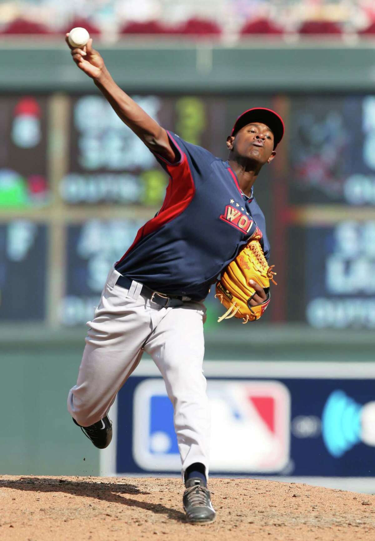 In this July 13, 2014, file photo, World’s pitcher Luis Severino throws a pitch during the All-Star Futures baseball game against Team United States in Minneapolis. Touted pitching prospect Severino will make his next start with the New York Yankees. Manager Joe Girardi says the 21-year-old Severino will start at home next week against Boston, but did not specify when he would get the ball.